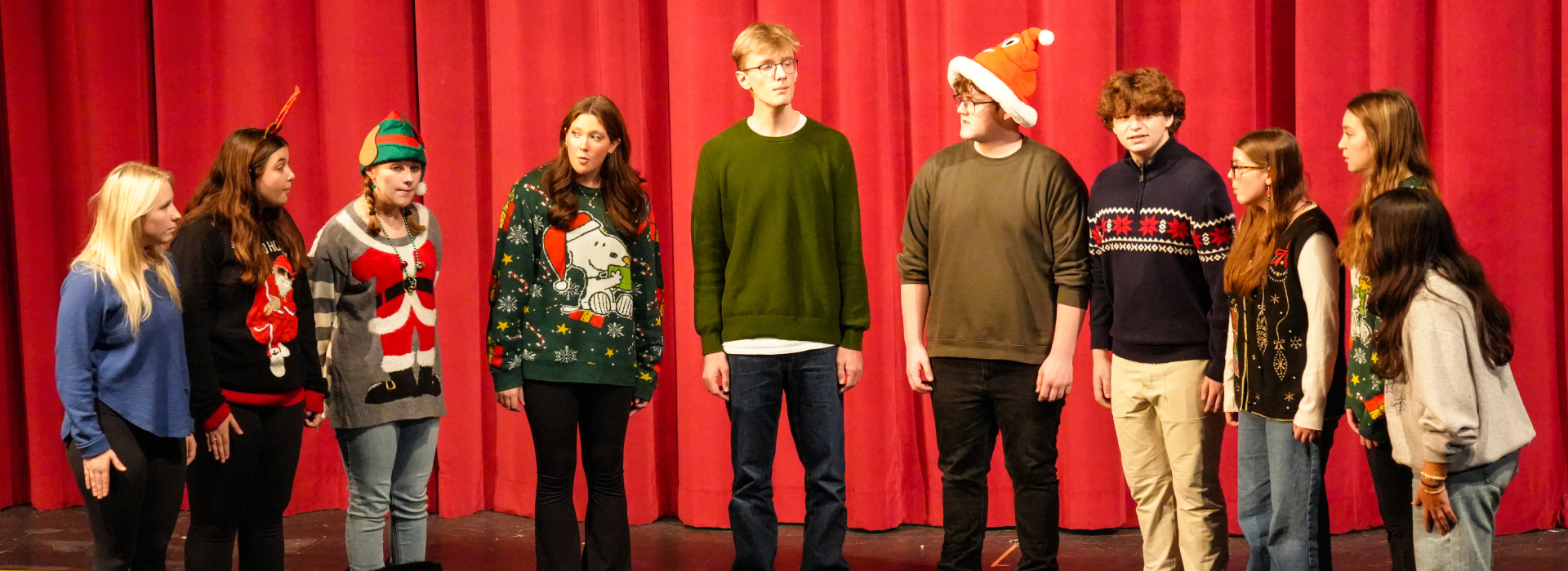 Students in the Turpin Choir perform a song during a holiday assembly